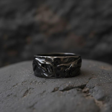 Side angle view of handcrafted Creation of Adam ring displaying three-dimensional relief work and band detail