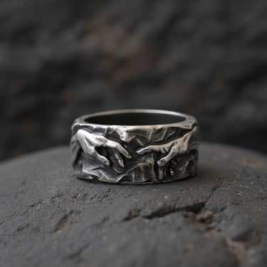 925 sterling silver Creation of Adam ring with black rhodium finish showing Michelangelo's divine hands design