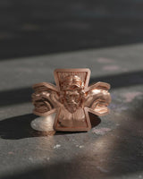 Rose gold finish crucifixion cross ring showing intricate facial features and religious craftsmanship detail