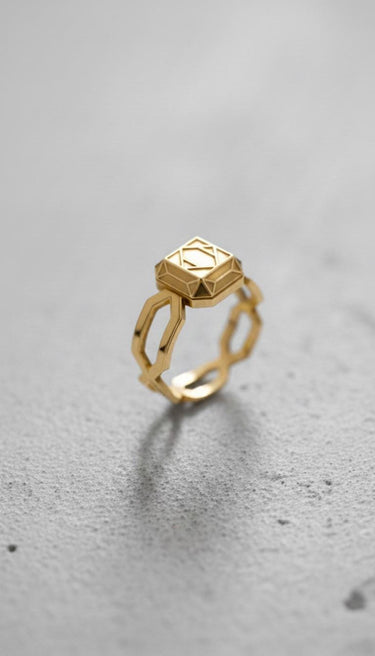 14K gold vermeil dwarven ring with geometric faceted design on grey background for fantasy jewelry lovers