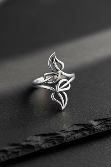 Polished 925 sterling Silver Leaf Ring showcasing its elegant, flowing botanical design against a black slate background.