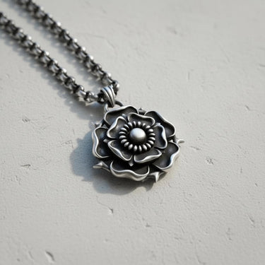 Handcrafted Tudor Rose Pendant on an intricate silver chain, angled to show the 3D depth and antique finish of the piece.