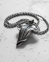 Handcrafted Elvish Leaf Pendant in 925 sterling silver with oxidized details, shown on a textured light gray surface.