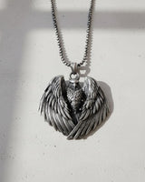 Oxidized 925 sterling silver eagle pendant with detailed attack wings, shown from the front on a rolo chain.