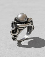 Side profile of a 925 sterling silver octopus ring showing the intricate tentacle band design and oxidized finish.