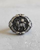 Front view of the Silver Agnus Dei Ring featuring the Lamb of God and the 'Ecce Agnus Dei' Latin inscription on an oxidized background.