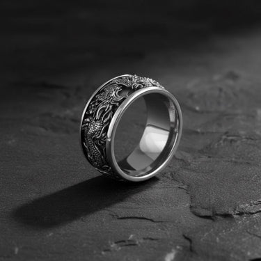 Angled view of the handcrafted 925 sterling silver phoenix ring, highlighting the intricate feather and flame details.