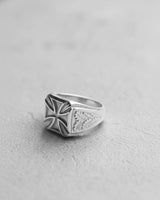 Handcrafted signet-style Silver Iron Cross ring displaying the three-dimensional quality of the cross and band details.