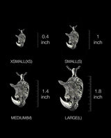 Size comparison chart for the silver rhino pendant, displaying XS, S, M, and L options with inch measurements.