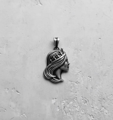 Oxidized 925 sterling silver Virgo Queen Pendant on a grey background, highlighting the antique finish and fine details.