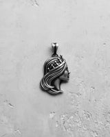 Direct profile view of the Silver Queen Pendant in 925 sterling silver, highlighting the crown and serene facial features.