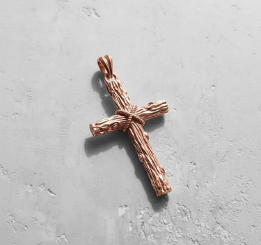 Rose gold plated Silver Wood Cross Pendant showcasing its warm finish and rugged, nature-inspired design details.