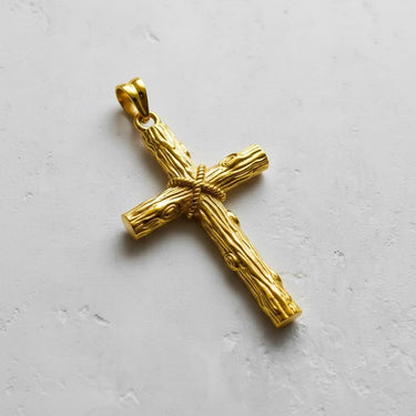 Yellow gold plated Silver Wood Cross Pendant, angled to highlight the shiny finish and intricate wood knot details.