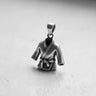 Oxidized 925 sterling silver Karate Gi pendant showing detailed belt knot and fabric folds on a white surface.