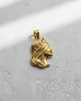 Gold vermeil Silver Queen Pendant showing the detailed profile of a goddess with flowing hair on a textured white surface.