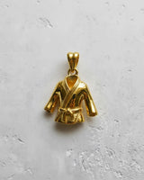 Top-down view of the gold-plated martial arts uniform pendant, highlighting its polished finish and detailed lapels.