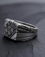 Side profile of the men's brutalist nugget ring, showcasing the deep texture and the smooth, geometric shank design.