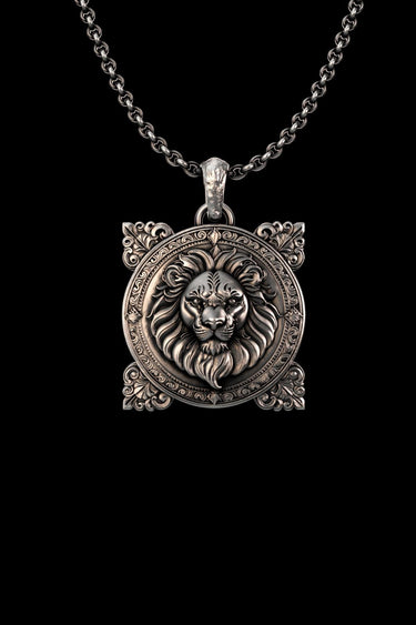 Silver Lion Pendant with detailed mane and Victorian filigree frame, shown on a silver chain against a black background.