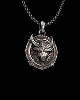 Angled view of the handcrafted Taurus bull head pendant, highlighting the 3D relief and intricate carvings on the 925 silver.