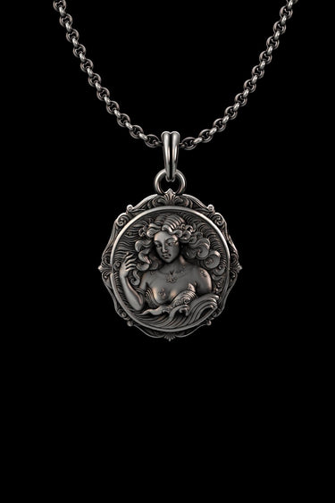 Detailed front view of the handcrafted Aquarius pendant, highlighting the oxidized finish on the sterling silver goddess face.