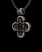 Close-up of the detailed Orthodox cross pendant with an oxidized finish, highlighting the angelic figures and decorated bail.