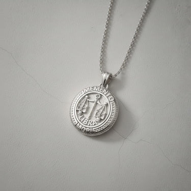 Polished 925 sterling Silver Libra Skull Pendant on a matching silver chain, presented against a clean, light background.