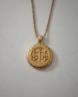 Gold-plated version of the Libra Skull Pendant, highlighting the intricate details of the scales and gothic design.