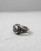 Side profile of the oxidized Silver War Ring, highlighting the intricate cross and scrollwork details along the band.