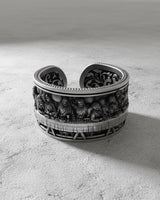 Oxidized sterling silver Last Supper ring showing the detailed bas-relief of Jesus and apostles on a textured surface.