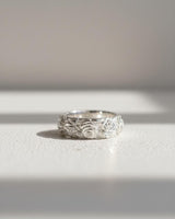 Front view of the handcrafted silver rose ring in bright sunlight, showcasing the shiny 925 sterling silver and intricate design.