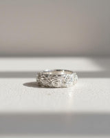 925 sterling silver Japanese rose ring featuring intricate floral relief pattern on textured white background
