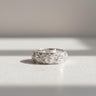 925 sterling silver Japanese rose ring featuring intricate floral relief pattern on textured white background