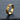 14K gold vermeil infinity knot ring with woven pattern on dark slate background symbolizing eternal love