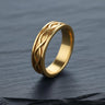 14K gold vermeil infinity knot ring with woven pattern on dark slate background symbolizing eternal love