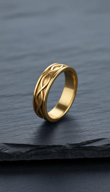 14K gold vermeil infinity knot ring with woven pattern on dark slate background symbolizing eternal love