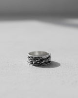 Side view of the Silver Wolf Ring for men, highlighting the intricate 3D sculpting of the wolves on the sterling silver band.