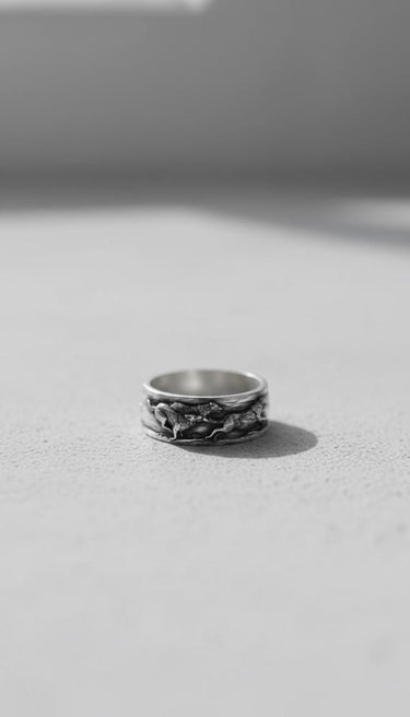 Side view of the Silver Wolf Ring for men, highlighting the intricate 3D sculpting of the wolves on the sterling silver band.