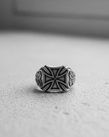 Front view of a 925 sterling silver Iron Cross ring, highlighting the bold, symmetrical design and dark oxidized background.