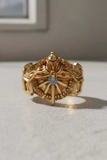 Front view of gold vermeil Silver Lucii Ring featuring a central gem and intricate mechanical details for fantasy gamers