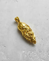 Angled view of the gold-plated Viking head pendant, highlighting the 3D relief of the beard and fierce facial expression.