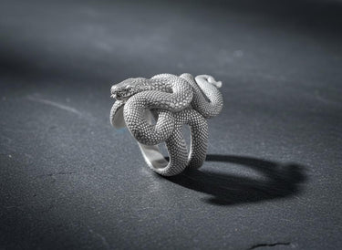 Close-up view of the 925 sterling silver snake ring's head, showing intricate carving details and the oxidized scale pattern.