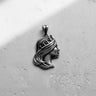 Side view of the Silver Queen Pendant in sterling silver, displaying the elegant crown and sculptural details of the hair.