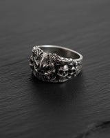 Angled view of the handcrafted 925 sterling silver demon skull ring, highlighting the deep oxidized finish and band detail.