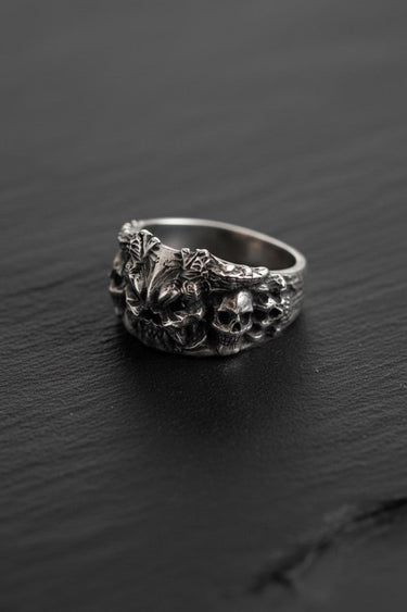 Angled view of the handcrafted 925 sterling silver demon skull ring, highlighting the deep oxidized finish and band detail.