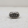 Handcrafted Silver War Ring featuring 'WAR' in a bold gothic font, displayed front-on against a textured light background.