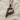 Detailed close-up of handcrafted sterling silver bird letter P pendant showing oxidized feather texture