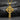 Angled close-up of gold vermeil Celtic cross pendant highlighting polished finish and depth