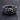 Detailed macro shot of handcrafted Hannya mask ring revealing the oxidized silver finish and complex flowing patterns