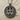 Close-up of oxidized 925 sterling silver Gemini pendant showing intricate relief and zodiac symbols