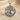 Close up of handcrafted silver yggdrasil pendant showing detailed branch texture